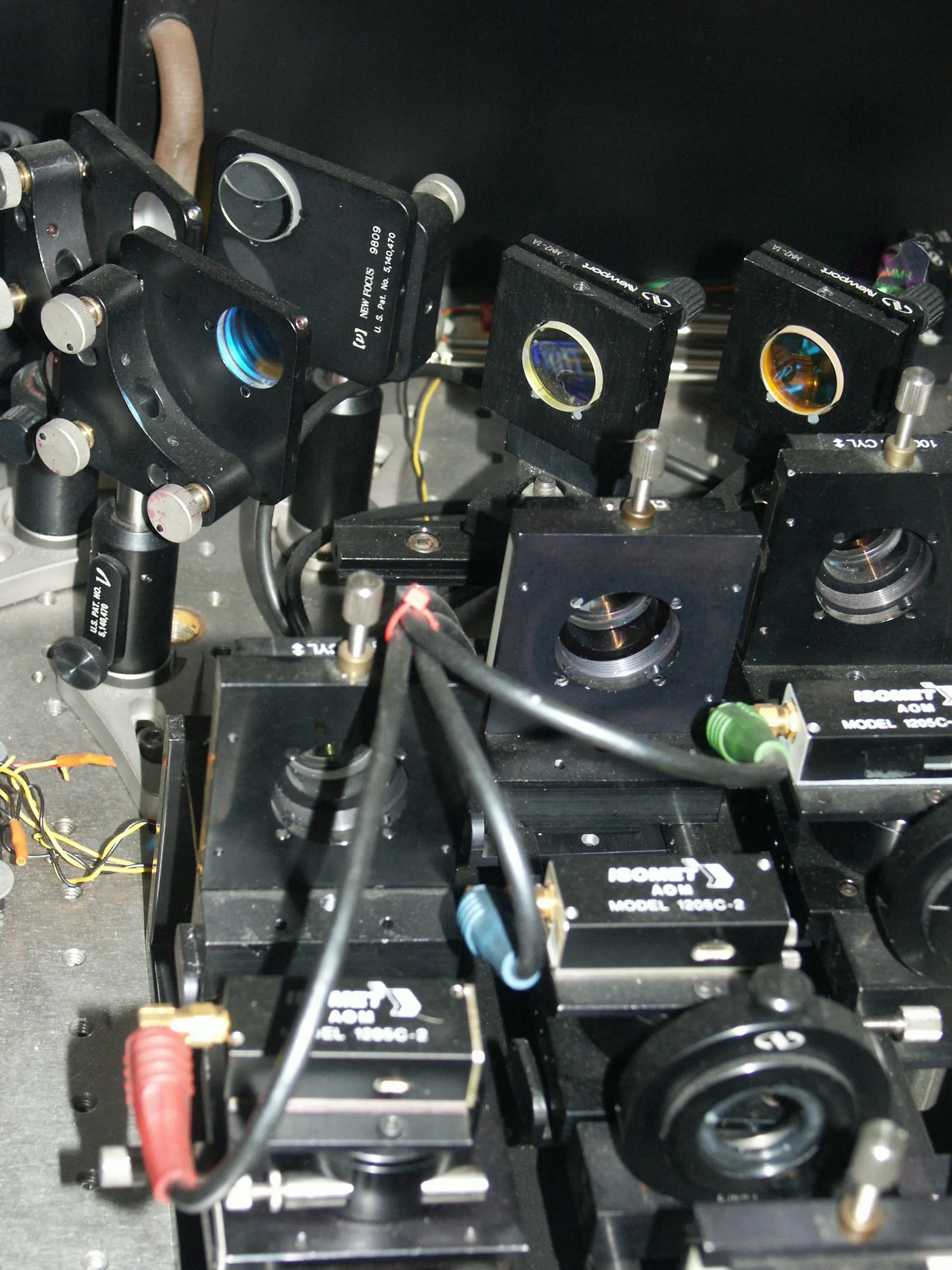 A dense optical bench of mirrors, lenses, and acousto-optic modulators from one of Paul Linden's laser projection systems.